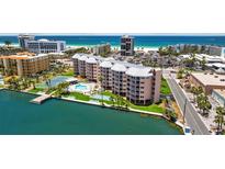 Coastal condo showcases beach access, boat dock, pool, and tennis courts, offering luxury waterfront living at 5445 Gulf Blvd # 210, St Pete Beach, FL 33706