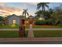 Charming single-story home featuring a well-manicured lawn, brick accents, and mature landscaping with beautiful curb appeal at 625 Fayette S Dr, Safety Harbor, FL 34695