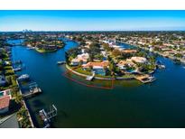 Waterfront property with a pool and dock on a sunny day showcasing the expansive canal views at 2096 Massachusetts Ne Ave, St Petersburg, FL 33703