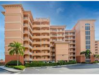 Stunning multi-story condo building with parking and beautiful landscaping and a vibrant architectural design at 530 S Gulfview Blvd # 203, Clearwater Beach, FL 33767
