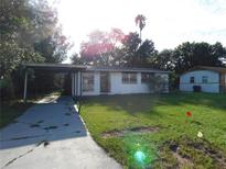 Charming single-story home with a well-maintained lawn and a convenient carport at 5707 S 79Th St, Tampa, FL 33619