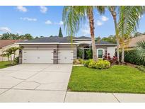 Beautiful single-story home with well-maintained landscaping, large driveway, and a three-car garage at 4505 Anaconda Dr, New Port Richey, FL 34655