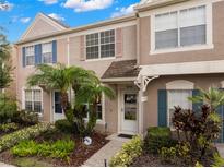 Charming townhouse featuring manicured landscaping and colorful shutters at 6336 Bayside Key Dr, Tampa, FL 33615
