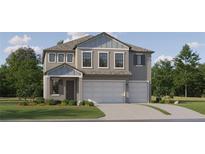 Charming two-story home featuring a three-car garage and well-maintained landscaping at 9414 Gladsome Dr, Land O Lakes, FL 34637