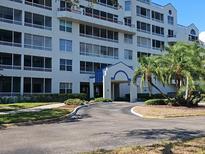 Beautiful multi-story condo building featuring private screened patios and a covered entrance at 2333 Feather Sound Dr # A401, Clearwater, FL 33762