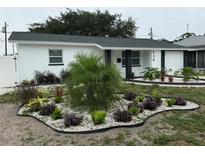 Charming home featuring a well-manicured front yard with lovely landscaping at 539 Freeport N Ave, St Petersburg, FL 33702
