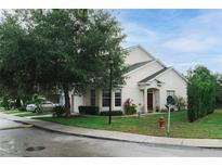 Charming single Gathering home with well-manicured lawn and mature landscaping at 9616 Carlsdale Dr, Riverview, FL 33578