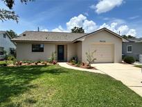 Charming single-story home featuring a well-manicured lawn and freshly landscaped garden beds at 5435 20Th N Ave, St Petersburg, FL 33710