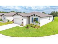 Beautiful single-story home with well-manicured lawn and landscaping for great curb appeal at 3082 Forrest Plum Ct, Zephyrhills, FL 33540