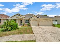 Charming single-story home with a well-manicured lawn and a two-car garage in a sunny location at 502 Arch Ridge Loop, Seffner, FL 33584
