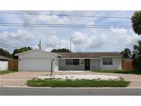 Charming single-story home with attached garage and well-maintained landscaping at 6081 22Nd N Ave, St Petersburg, FL 33710