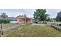 Cozy single-Gathering home featuring a covered carport and fenced yard at 1401 43Rd S St, St Petersburg, FL 33711