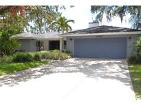Charming single-story home featuring an attached two car garage and well-maintained landscaping at 3005 Wilton Ln, Valrico, FL 33596