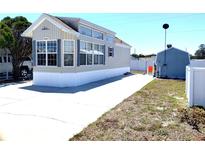 Charming single-Gathering home with a large driveway and well-manicured landscaping at 35152 Dodie, Zephyrhills, FL 33541