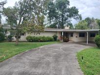 Charming single-story home featuring a covered carport, brick exterior and well-maintained landscaping at 503 Sunset Rd, Plant City, FL 33563