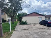 Charming single-story home with a well-maintained lawn and classic design at 9902 N Myrtle St, Tampa, FL 33617