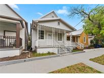 Charming single-story home with a welcoming front porch and neatly maintained yard at 2320 W Walnut St, Tampa, FL 33607