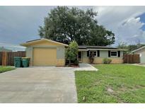 Charming single-story home with a welcoming facade and attached garage on a sunny day at 3619 15Th Se Ave, Largo, FL 33771