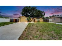 Charming home with a well-maintained front yard and long driveway at 3619 15Th Se Ave, Largo, FL 33771
