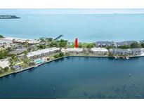 Panoramic aerial view of waterfront condo community featuring lush landscaping and marina access at 611 Destiny Dr, Ruskin, FL 33570