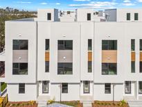 Modern townhouse exterior with white facade and contemporary design elements for stylish urban living at 303 15Th N St, St Petersburg, FL 33705
