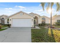Charming single Gathering home with a well-manicured lawn and beautiful landscaping at 4411 Whitton Way, New Port Richey, FL 34653