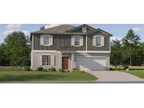 Charming two-story home with a gray exterior, symmetrical window placement, and a well-maintained lawn at 1805 Tropical Oasis Ave, Plant City, FL 33565