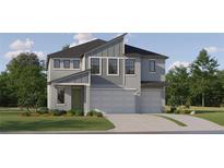 Striking new construction home featuring a three-car garage, modern design, and landscaped front yard at 18469 Serene Lake Loop, Lutz, FL 33548