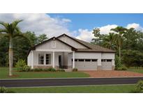 Charming single-story home with a three-car garage, landscaped lawn, and stone accents at 4752 Southern Valley Loop, Brooksville, FL 34601