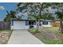 Charming single-story home featuring a well-maintained front yard and attached garage at 10703 59Th Ave, Seminole, FL 33772