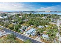 Charming property with a freshly painted exterior and lush landscaping, situated near water and offering serene views at 613 6Th E Ave, Bradenton, FL 34208
