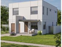 Modern home featuring a minimalist design, clean lines, and inviting curb appeal with a small front yard and seating area at 2932 Fairfield S Ave, St Petersburg, FL 33712