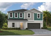 Charming two-story home with a two-car garage, a welcoming front lawn and a quaint front door at 37029 Sagemoor Dr, Zephyrhills, FL 33541