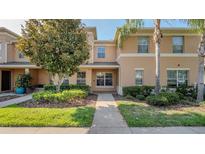 Inviting townhome featuring neat landscaping and a well-maintained exterior at 9752 Trumpet Vine Loop, Trinity, FL 34655
