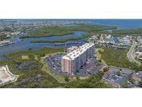 Stunning aerial view of the waterfront condo complex, showcasing its location and ample parking at 4516 Seagull Dr # 601, New Port Richey, FL 34652