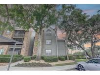 Inviting condo building with lush landscaping, mature trees, and a well-maintained exterior at 2500 Winding Creek Blvd # G307, Clearwater, FL 33761