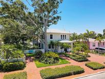 Charming two-story home with meticulously landscaped front yard, mature trees and inviting brick paved drive at 4742 13Th N Ave, St Petersburg, FL 33713