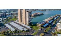 Scenic aerial view of a condo building, showcasing beautiful waterfront views and convenient covered parking at 7300 Sun Island S Dr # 1505, South Pasadena, FL 33707