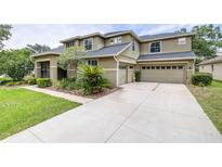 Stunning two-story home with attached three-car garage and well-maintained landscaping at 5931 Cherry Oak Dr, Valrico, FL 33596