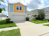Inviting two-story home with a spacious driveway and two car garage at 13118 Zolo Springs Cir, Riverview, FL 33579