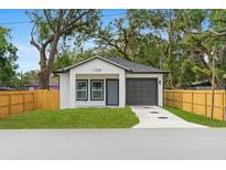 Charming single-story home with a well-manicured lawn and a one car garage at 7509 E 26Th Ave, Tampa, FL 33619