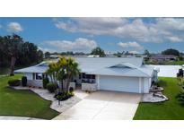 Beautiful single Gathering home featuring mature landscaping, a well maintained yard, and two car garage at 1407 Brattleboro Cir, Sun City Center, FL 33573