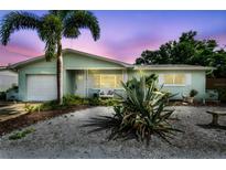 Charming single-story home with lush landscaping and a well-maintained exterior and manicured lawn at 11775 84Th Ave, Seminole, FL 33772
