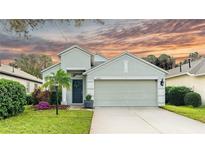 Charming single-Gathering home featuring a well-manicured lawn and a two-car garage at 14320 Tree Swallow Way, Lakewood Ranch, FL 34202