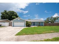 Charming single-story home with a well-manicured lawn and an attached two-car garage at 3905 31St W Ave, Bradenton, FL 34205