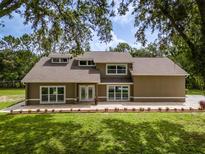 Charming home features large windows, manicured lawn, and fresh landscaping at 4044 Red Fox Ct, Wesley Chapel, FL 33543
