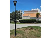 Inviting exterior view showcasing the well-maintained landscaping and architecture under a bright, sunny sky at 4304 Harbor House Dr, Tampa, FL 33615