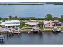 Waterfront homes with private docks offer stunning views of the bay at 5782 Westshore Dr, New Port Richey, FL 34652
