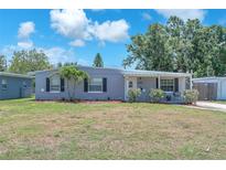 Charming single-story home featuring a well-maintained lawn and classic architectural details at 5927 10Th N St, St Petersburg, FL 33703