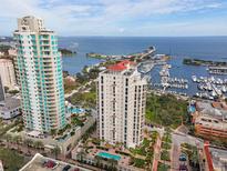 Breathtaking aerial view of waterfront condo towers with marina, offering luxury living and stunning ocean views at 100 Beach Ne Dr # 301, St Petersburg, FL 33701